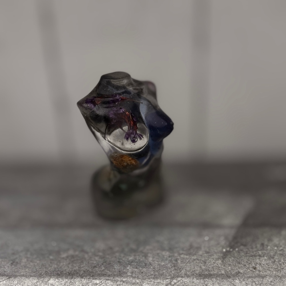 Artistic Resin Sculpture with Embedded Elements